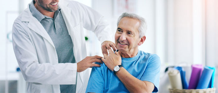 Doctor with hand on patients shoulder